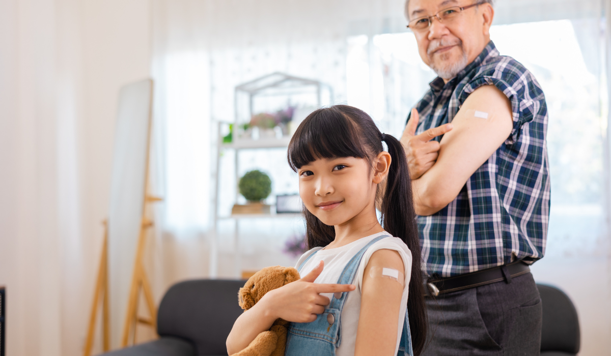 Girl and grandad get vaccinated