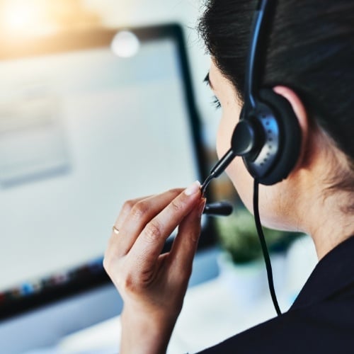 woman wearing a headset at a call center