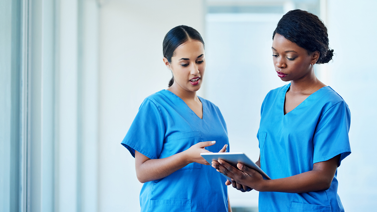 Nurses hold an ipad