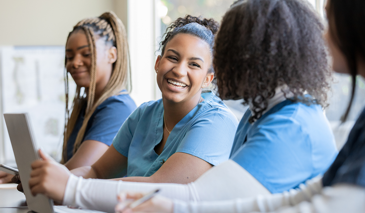 Healthcare workers gather around a table