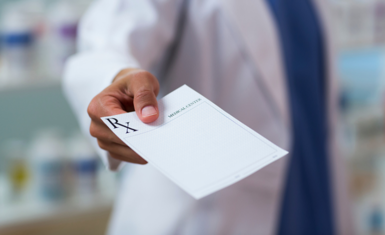 doctor holding a prescription/RX script